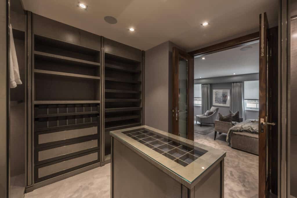 Master Dressing Room with veneered custom fitted joinery with polished nickel inlays