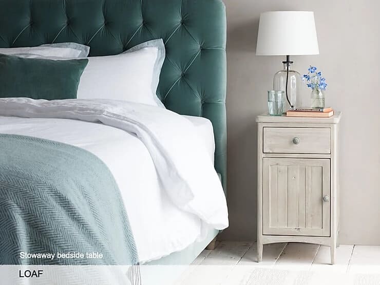 Bedside table styled with accessories