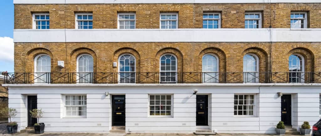 Brick terrace of houses with arched ground-floor windows
